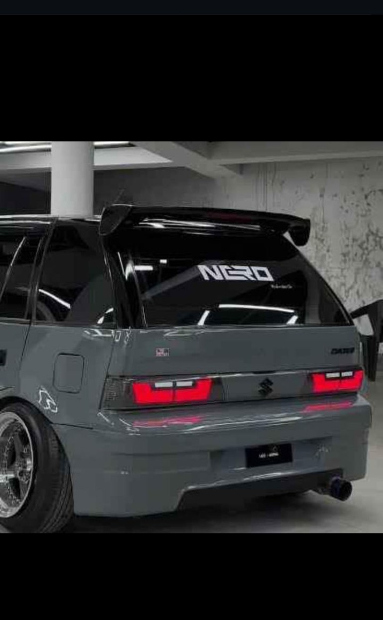 Universal rear spoiler fitted on a hatchback